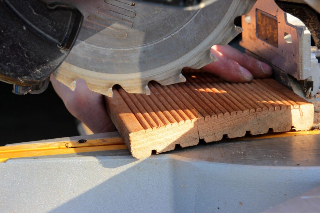 chop saw, saw blade, teeth of the saw blade, saw not in operation, wooden board, bangkirai, handyman, shortening wood, security protection, operation of the saw, precautions, carpentry, outdoors, saw blade, handyman, handyman, handyman, carpentry, carpentry, carpentry, carpentry, carpentry